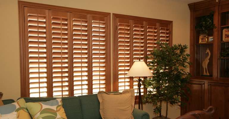 Natural wood shutters in Boston living room.